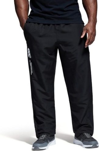 Man wearing black athletic trousers and black T-shirt, showcasing comfortable activewear style