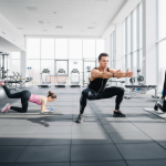 Gym session with three people exercising, focusing on balance and strength training in a modern fitness centre