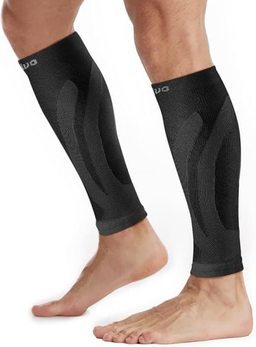 Black compression calf sleeves for leg muscle support and improved circulation during exercise or recovery