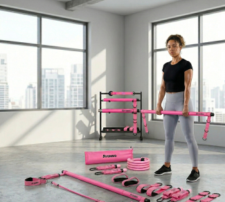 Woman working out with pink Ayombo fitness gear in a bright gym surrounded by equipment and large windows